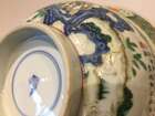 
	
		A Chinese porcelain boy and chicken bowl, 19th century, painted in famille verte enamels...