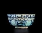 An openwork black, blue and white pottery bowl, possibly Kirman, Iran, 18th century, 
On short...