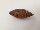 
	
		A Chinese hediao nut and stand, early 20th century, carved as a boat and inscribed to the...