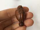 
	
		A Chinese hediao nut and stand, early 20th century, carved as a boat and inscribed to the...