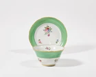 A Chinese porcelain English-decorated tea bowl and saucer, late 18th / early 19th century, the...