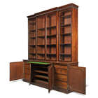 
	
		A George III mahogany breakfront bookcase, late 18th century, the fluted cornice above...