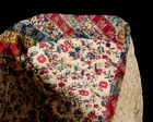 A silk satin stitch and running stitch embroidered and quilted cotton conical hat, Qajar Iran,...
