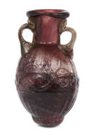 A Sidonian small mould-blown flask,second half of 1st century A.D.,
made in streaky purple glass...