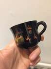 
	
		A Chinese painted lacquer coffee set, 20th century, comprised of eight cups and saucers...
