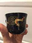 
	
		A Chinese painted lacquer coffee set, 20th century, comprised of eight cups and saucers...