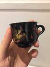 
	
		A Chinese painted lacquer coffee set, 20th century, comprised of eight cups and saucers...