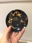 
	
		A Chinese painted lacquer coffee set, 20th century, comprised of eight cups and saucers...