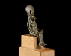 A small Egyptian bronze figure of a seated lion-headed Sekhmet,Late Period, circa 664-525...