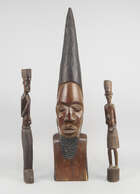 
	
		A Solomon Islands canoe prow figure head, in the form of a man, with elongated nose and...