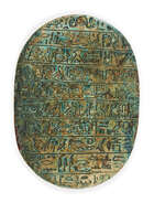 
	
		An Egyptian revival ware green-glazed stone scarab, 19th century, inscribed with 10 lines...