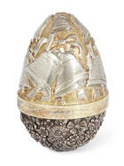 
	
		 A limited edition silver gilt surprise egg by Stuart Devlin, London, c.1986, opening to...