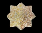 A lustre star pottery tile, Kashan, Central Iran, 12th/13th century, 
With dense and radiating...