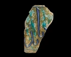 A fragmentary calligraphic lustre and cobalt blue pottery tile, Kashan, Central Iran, 12th/13th...
