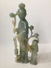 
	
		A Chinese jadeite figure of a woman and child, early 20th century, carved standing, each...