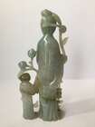 
	
		A Chinese jadeite figure of a woman and child, early 20th century, carved standing, each...