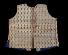 A small embroidered waist coat,India, 
yellow metal thread medallions against black, lined in...