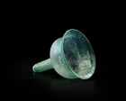 A Byzantine pale blue glass stemmed lamp insertcirca 6th Century A.D.,
With stand,
10.5cm...
