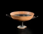 An Attic black-figure lip-cup,mid-6th Century B.C,
decorated with a band of black around the lip...