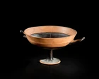 An Attic black-figure lip-cup,mid-6th Century B.C,
decorated with a band of black around the lip...