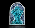 A large turquoise and cobalt blue glazed carved pottery tile or panel,  Timurid western...