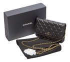 
	
		A Chanel clutch bag, the rectangular form black leather body designed with central Chanel...