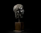 An Egyptian basalt head of a queen or goddessHellenistic, Ptolemaic dynasty, circa 300 - 30...