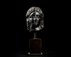 An Egyptian basalt head of a queen or goddessHellenistic, Ptolemaic dynasty, circa 300 - 30...