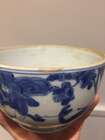 
	
		A Chinese porcelain bowl, Wanli period, painted in underglaze blue with a scholar seated...