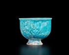 A conical turquoise blue glazed pottery bowl, Ilkhanid central Iran, 12th/13th century, 
On...