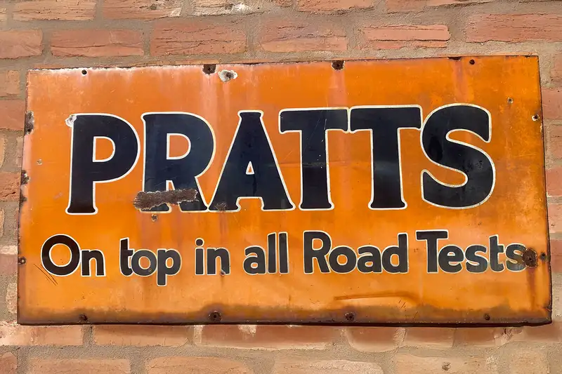Pratts On Top in all Road Tests Enamel Sign-Sold