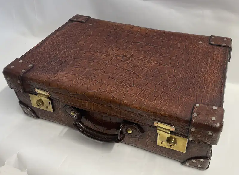 A Large Crocodile Skin Suitcase/Trunk Bearing the Initials  A.C.G.