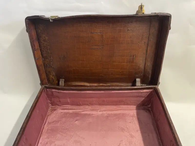 A Large Crocodile Skin Suitcase/Trunk Bearing the Initials  A.C.G.
