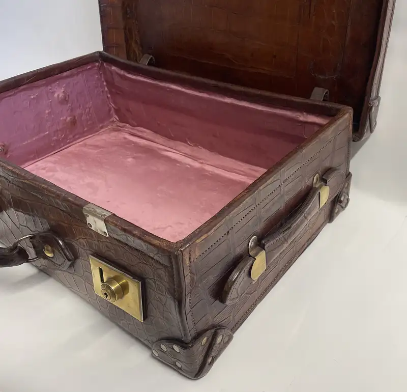 A Large Crocodile Skin Suitcase/Trunk Bearing the Initials  A.C.G.