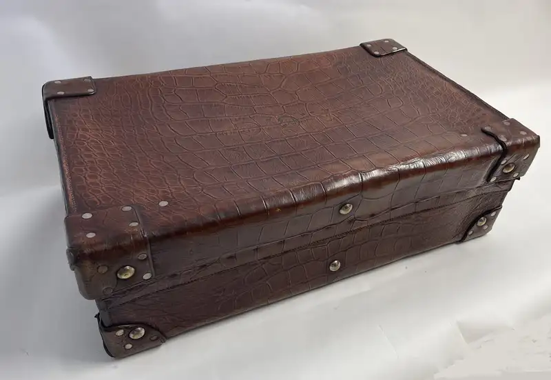A Large Crocodile Skin Suitcase/Trunk Bearing the Initials  A.C.G.