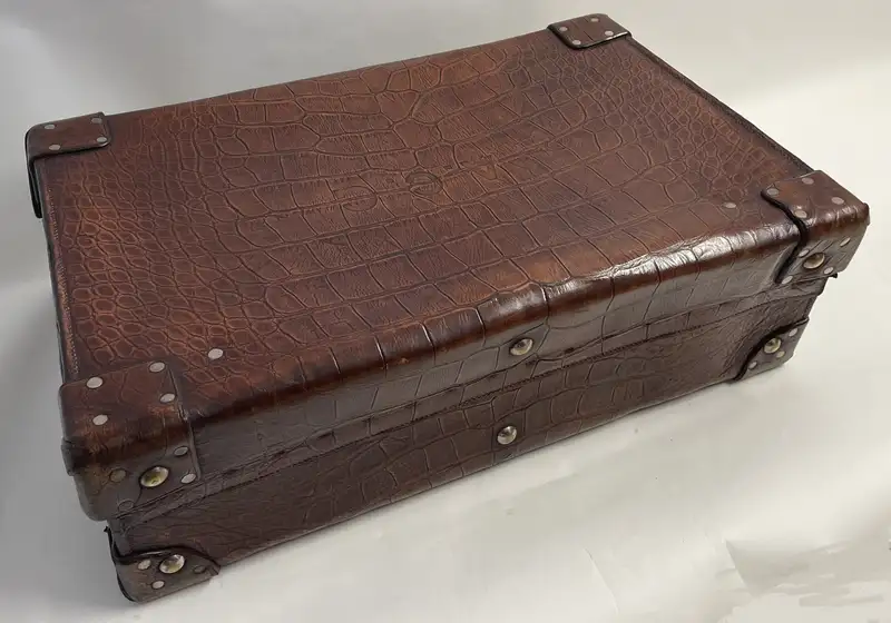 A Large Crocodile Skin Suitcase/Trunk Bearing the Initials  A.C.G.