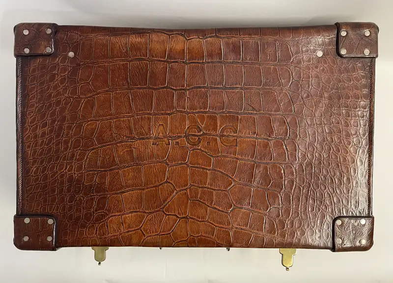 A Large Crocodile Skin Suitcase/Trunk Bearing the Initials  A.C.G.