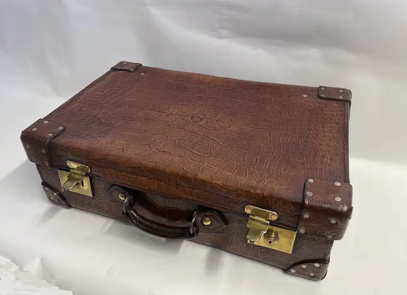 A Large Crocodile Skin Suitcase/Trunk Bearing the Initials  A.C.G.