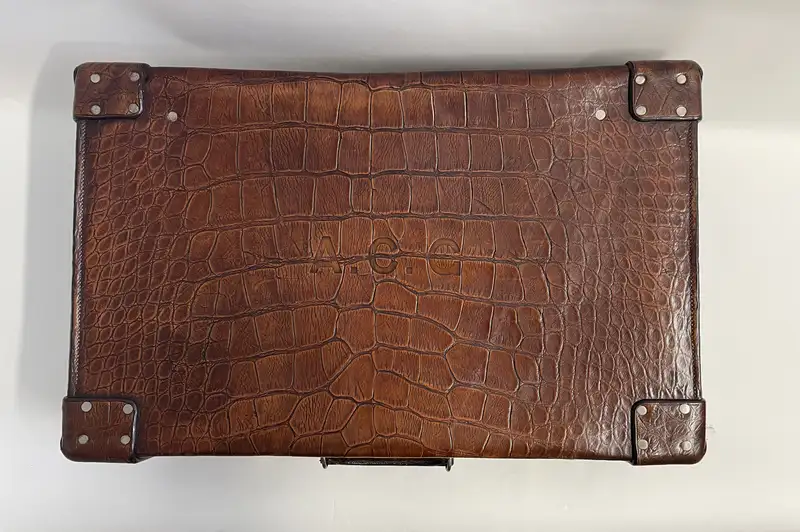 A Large Crocodile Skin Suitcase/Trunk Bearing the Initials  A.C.G.