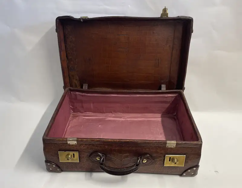 A Large Crocodile Skin Suitcase/Trunk Bearing the Initials  A.C.G.