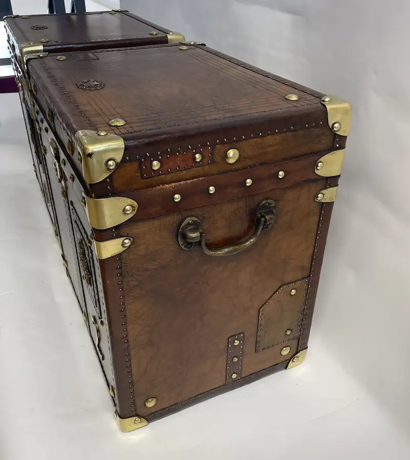 A Pair of Substantial Army and Navy Steamer Trunks-Sold