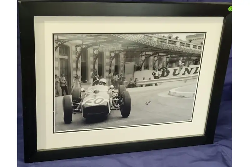 Sir Stiling Moss pictured in his Lotus 18 at Monaco in 1961.-For Sale