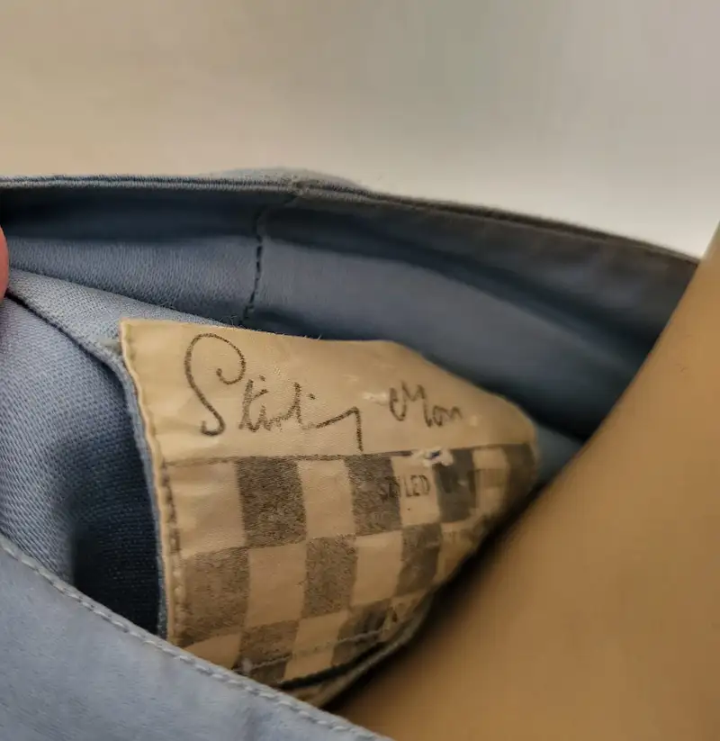 Sir Stirling Moss-Signed 'Ferrari' Race Suit and Period Helm-For Sale