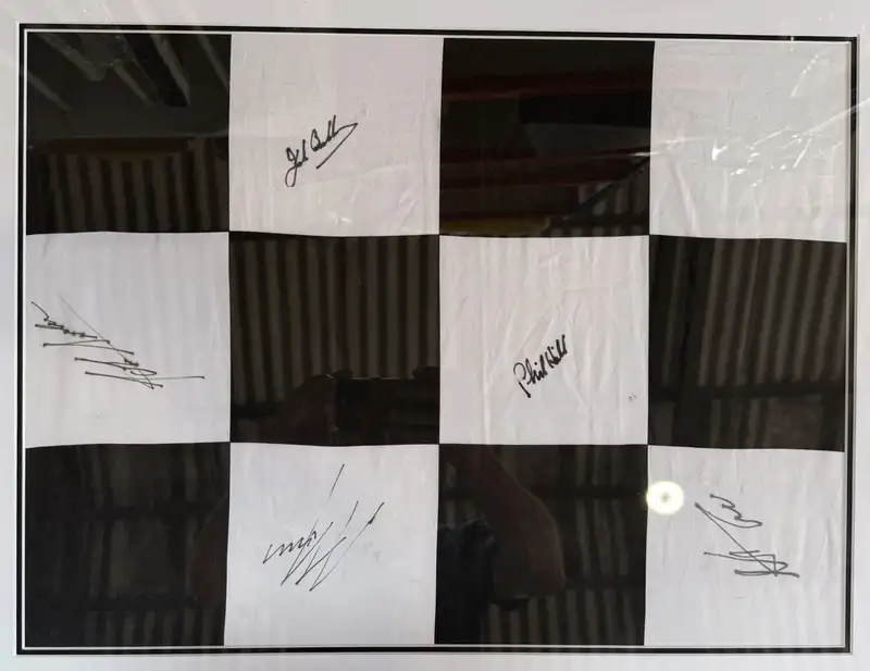 Large Framed and Glazed Chequered Flag Signed by Five Formul-For Sale