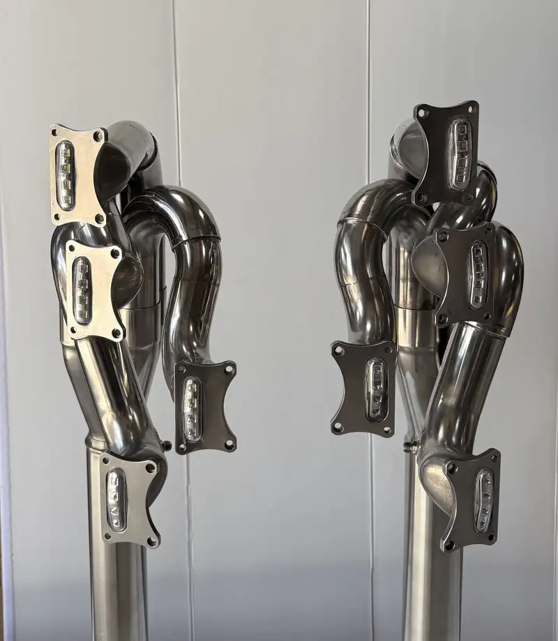 A Pair of Lamps Crafted from the Exhaust System of a Ford Co-For Sale