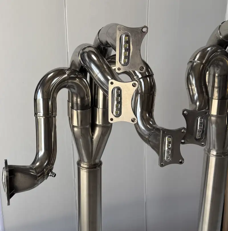 A Pair of Lamps Crafted from the Exhaust System of a Ford Co-For Sale