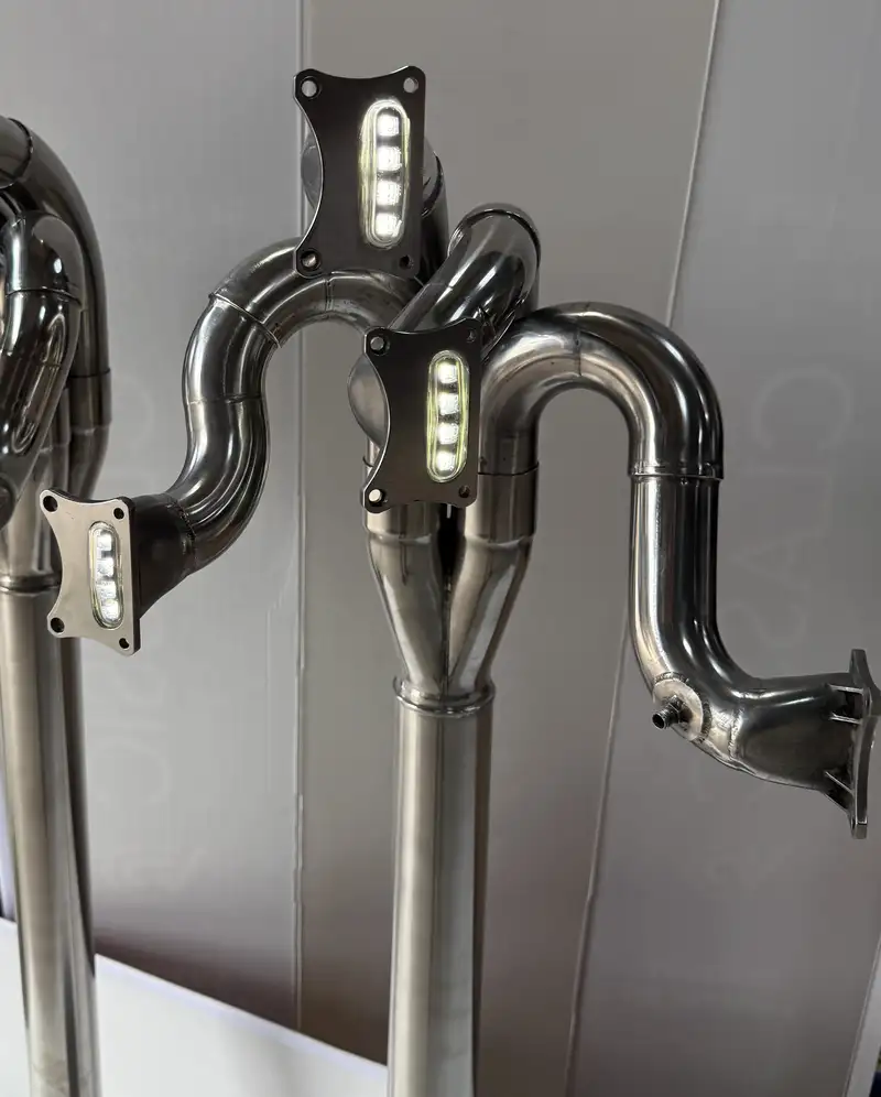 A Pair of Lamps Crafted from the Exhaust System of a Ford Co-For Sale