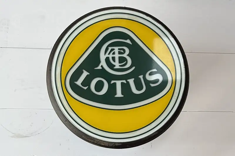 An F1 Rear Tyre Topped with a Toughened Glass Lotus Motif-Sold