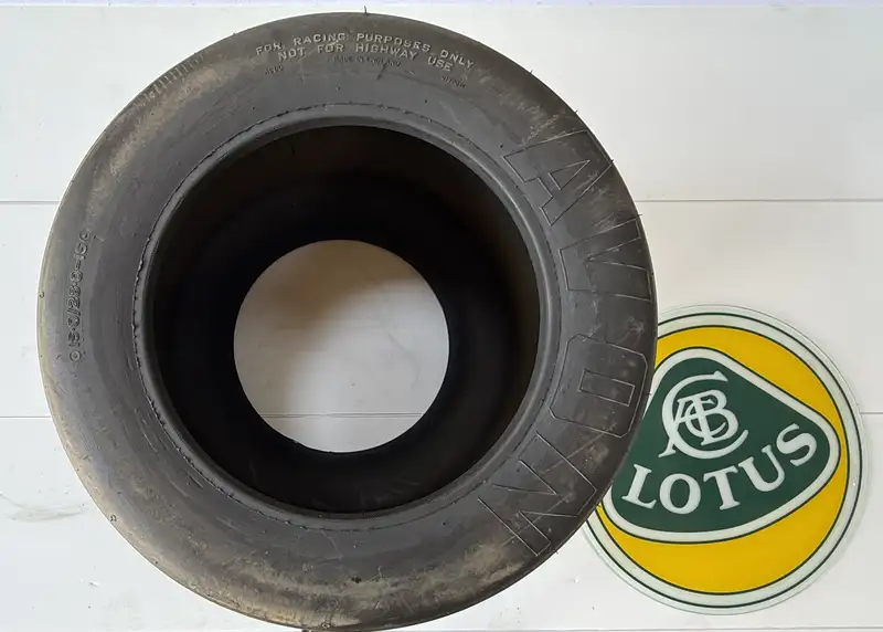 An F1 Rear Tyre Topped with a Toughened Glass Lotus Motif-Sold