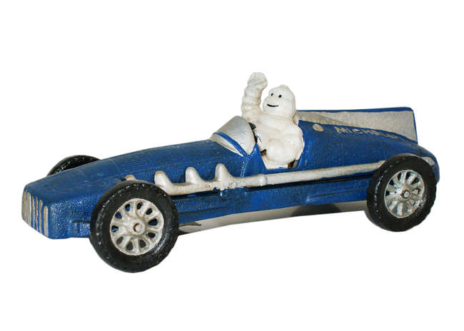 Michelin Man Race Car figure. -Sold